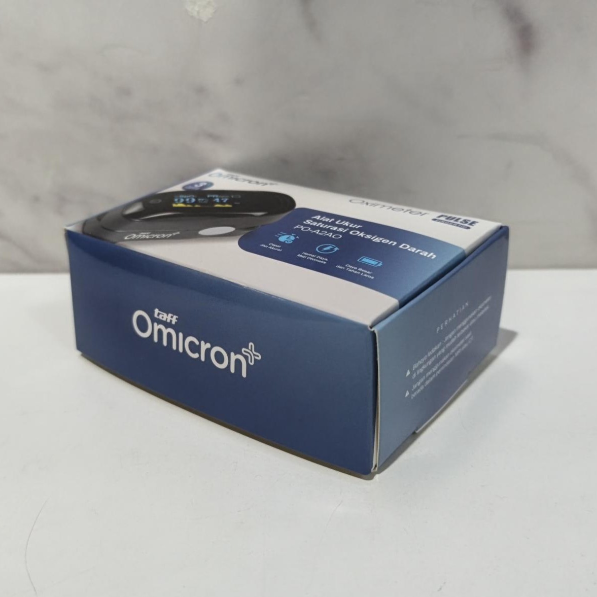 Gambar produk TaffOmicron Fingertip Pulse Oximeter Alat Ukur Saturasi Oksigen Darah - PO-A2AO - Kemasan